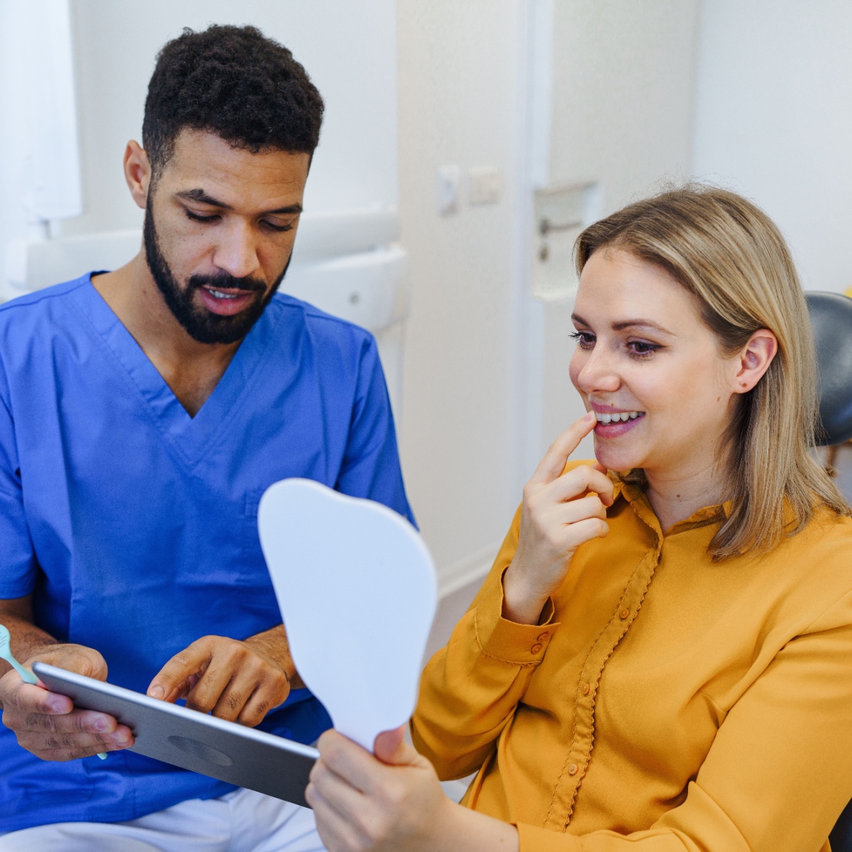 A dentist educating their patient using OrthoPhoto